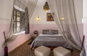 Postel nebo postele na pokoji v ubytování Riad Ciel d'Orient