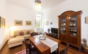 a living room with a table and a couch at Novak Bonaparte - Hvar city center in Hvar