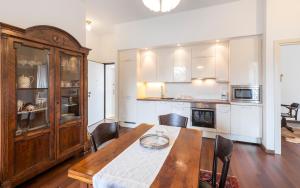 a kitchen with a wooden table and a dining room at Novak Bonaparte - Hvar city center in Hvar
