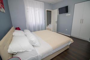 Postel nebo postele na pokoji v ubytování Villa M
