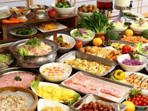 a buffet filled with lots of different types of food at Hotel Housei in Yamanouchi
