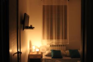 Un pat sau paturi într-o cameră la Apartman Goca