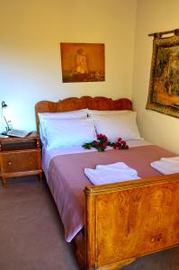 A bed or beds in a room at Kamara Stone House