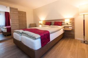 Ein Bett oder Betten in einem Zimmer der Unterkunft Hotel Saint Fiacre