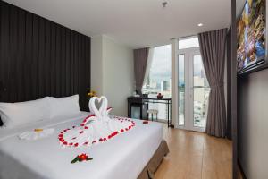 Agnes Nha Trang Hotel tesisinde bir odada yatak veya yataklar