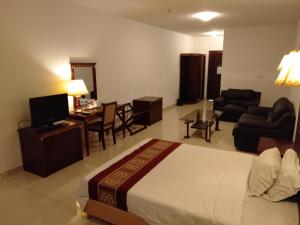 Uma televisão e/ou sistema de entretenimento em Excelsior Resort