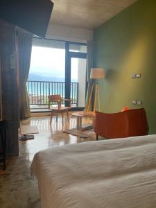 Postel nebo postele na pokoji v ubytování Come Sit Hostel