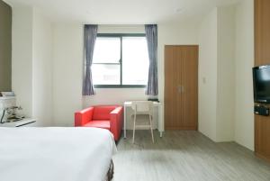 Voodi või voodid majutusasutuse Raise Hotel Taichung toas