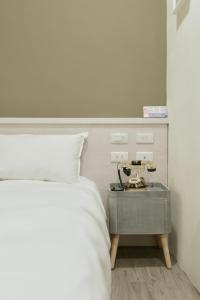 Voodi või voodid majutusasutuse Raise Hotel Taichung toas