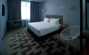 Postel nebo postele na pokoji v ubytování Urban H Hotel + 11 fotografií