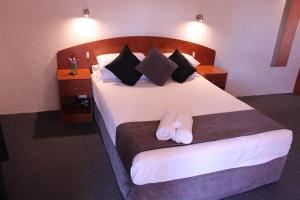 Postel nebo postele na pokoji v ubytování Childers Gateway Motor Inn