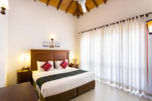 Postel nebo postele na pokoji v ubytování Hotel Yo Kandy