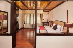 a bedroom with a bed in a room at Sterling Gangtok Orange Village in Gangtok