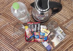 a table with a coffee maker and some food and drinks at Dutch Hosted B&B, ABC in Phnom Penh