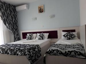Postel nebo postele na pokoji v ubytování Vila Zara