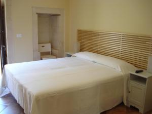 Postel nebo postele na pokoji v ubytování Iblea Paradise