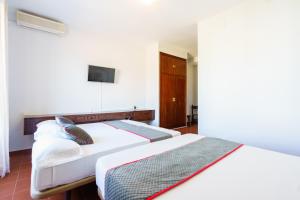 Cama o camas de una habitación en Venta del Alto Hotel las Cumbres by Vivere Stays