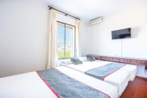 Cama o camas de una habitación en Venta del Alto Hotel las Cumbres by Vivere Stays