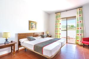 Cama o camas de una habitación en Venta del Alto Hotel las Cumbres by Vivere Stays
