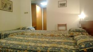 Postel nebo postele na pokoji v ubytování Park Hotel Galileo