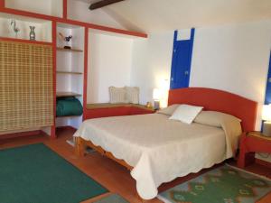 a bedroom with a large bed in a room at Casa 3 Águias in Aveiro