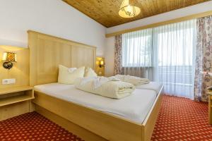 Postel nebo postele na pokoji v ubytování Ruperti - Gästehaus + 37 fotografií