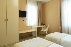 TV a/nebo společenská místnost v ubytování Aurum Suites