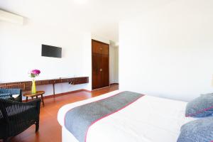 Cama o camas de una habitación en Venta del Alto Hotel las Cumbres by Vivere Stays