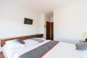 Cama o camas de una habitación en Venta del Alto Hotel las Cumbres by Vivere Stays