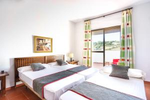 Cama o camas de una habitación en Venta del Alto Hotel las Cumbres by Vivere Stays