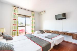 Cama o camas de una habitación en Venta del Alto Hotel las Cumbres by Vivere Stays