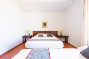 Cama o camas de una habitación en Venta del Alto Hotel las Cumbres by Vivere Stays