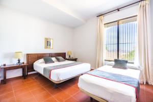 Cama o camas de una habitación en Venta del Alto Hotel las Cumbres by Vivere Stays