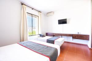 Cama o camas de una habitación en Venta del Alto Hotel las Cumbres by Vivere Stays