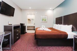 Postel nebo postele na pokoji v ubytování Express Inn - Spring