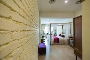 Postel nebo postele na pokoji v ubytování Aava Malacca Hotel