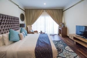 Postel nebo postele na pokoji v ubytování Aava Malacca Hotel
