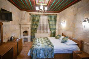 Postel nebo postele na pokoji v ubytování Cappadocia sightseeing Hotel