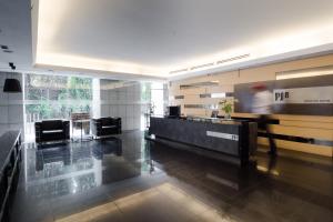 a lobby with a pdq reception desk in a building at PJ8 Service Suites by Airhost in Petaling Jaya