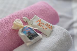a tag that says happy birthday on a teddy bear at Apartments Braut Krk in Krk