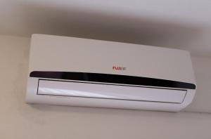 a white microwave oven sitting on top of a ceiling at Apartments Braut Krk in Krk