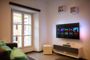 TV a/nebo společenská místnost v ubytování AZZURRO APARTMENT Piran