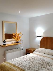 A bed or beds in a room at Cal Triquell