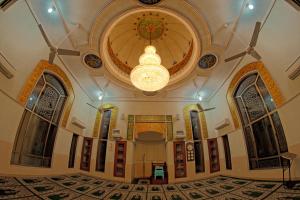 a large building with a ceiling and a chandelier at Faletti's Hotel Lahore in Lahore