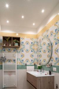 a bathroom with a sink and a mirror at Art de vivre in Sorrento