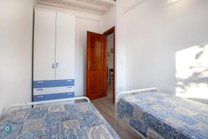 Postelja oz. postelje v sobi nastanitve Villino Grosseto
