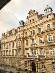 een groot stenen gebouw met twee koepels erop bij New Appartment-studio іn the center of Lviv in Lviv