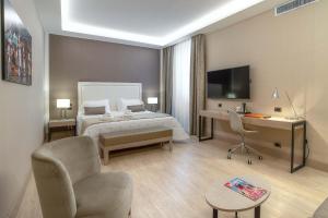 Postel nebo postele na pokoji v ubytování Hotel Genova