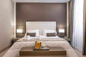 Postel nebo postele na pokoji v ubytování Hotel Genova