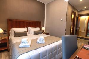 Postel nebo postele na pokoji v ubytování Hotel Genova